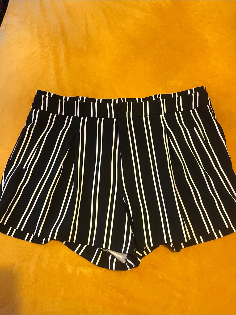 High-Waist Black Shorts with White Vertical Stripes